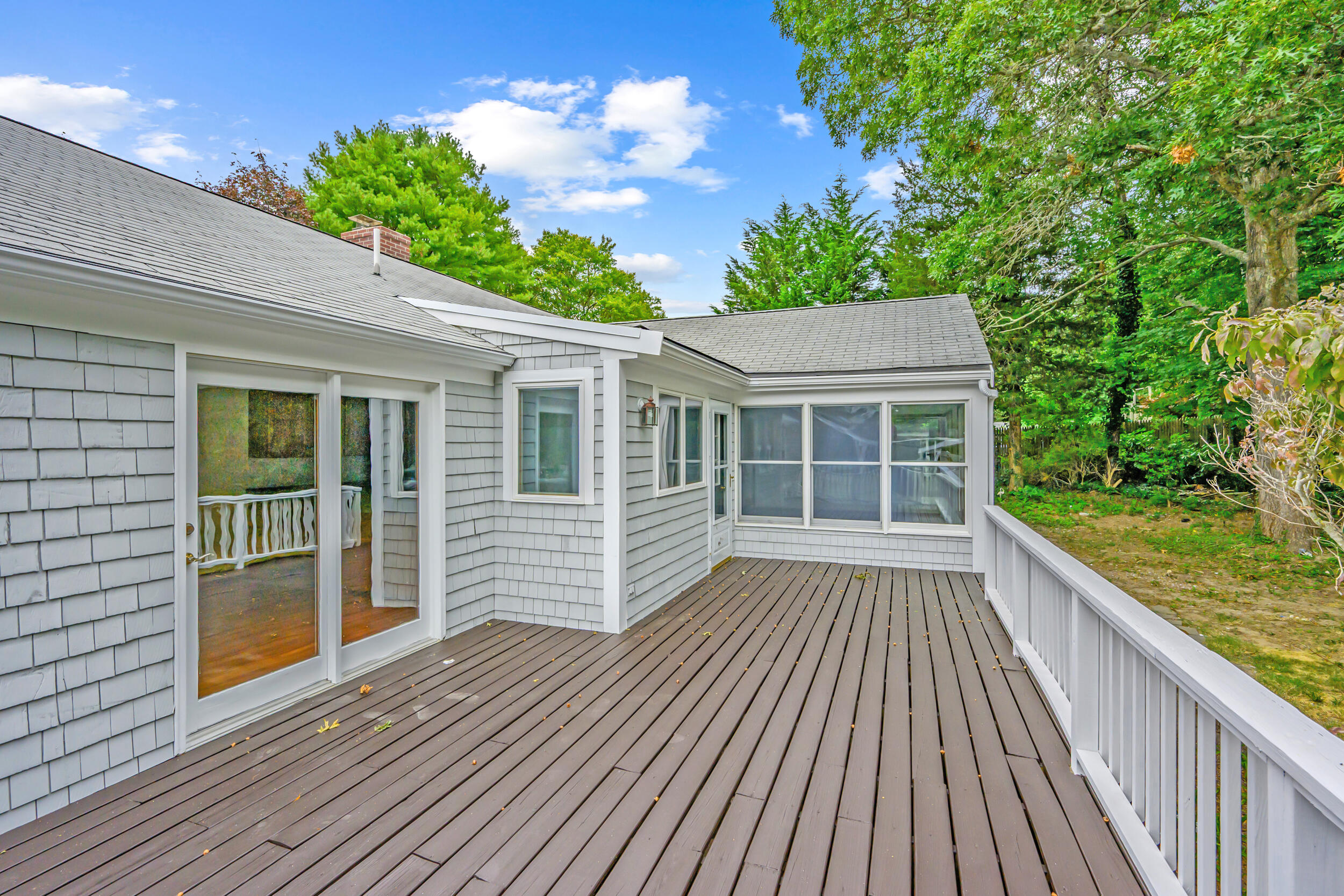 296 Buckskin Path Centerville, MA 02632 - Photo 22 of 34 a view of backyard with deck and garden