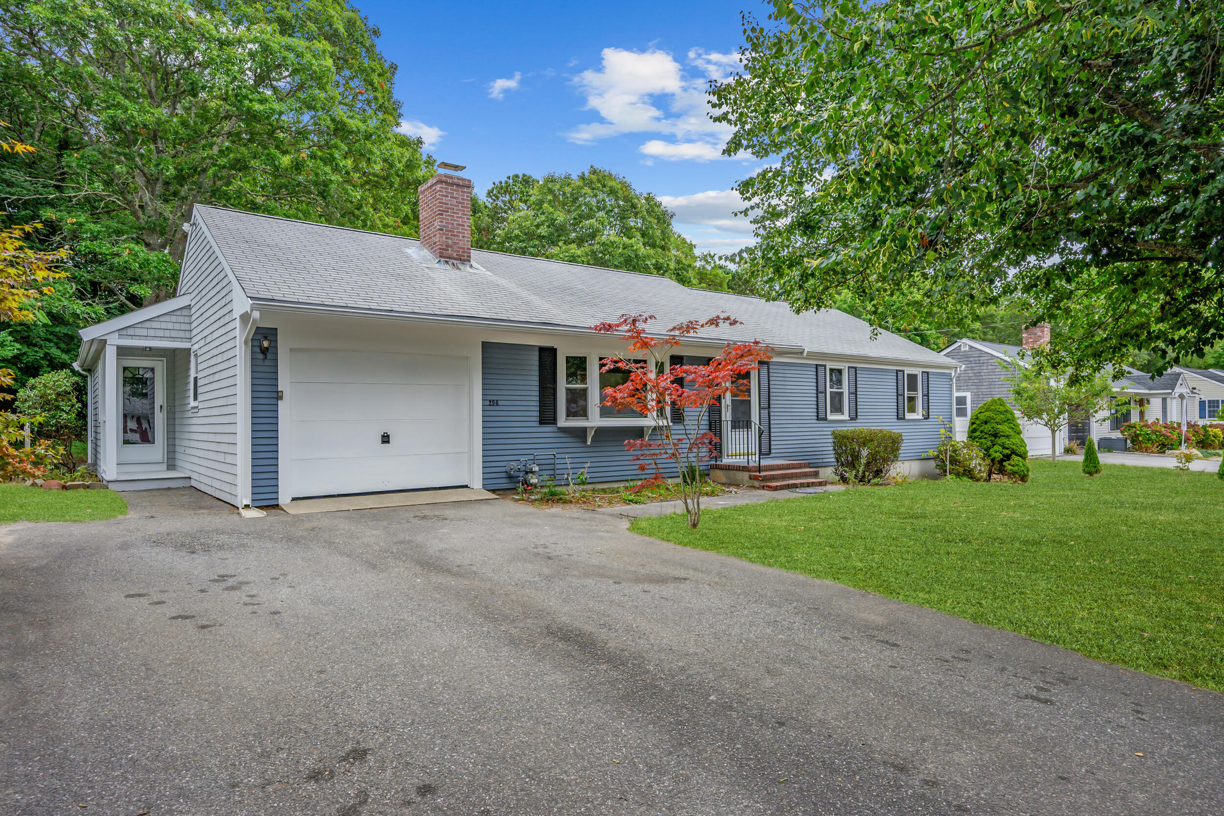 296 Buckskin Path Centerville, MA 02632 - Photo 26 of 34 a front view of house with yard and green space