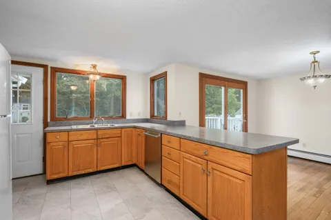 a kitchen with sink and window