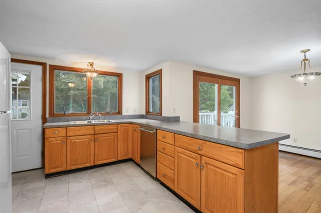 a kitchen with sink and window
