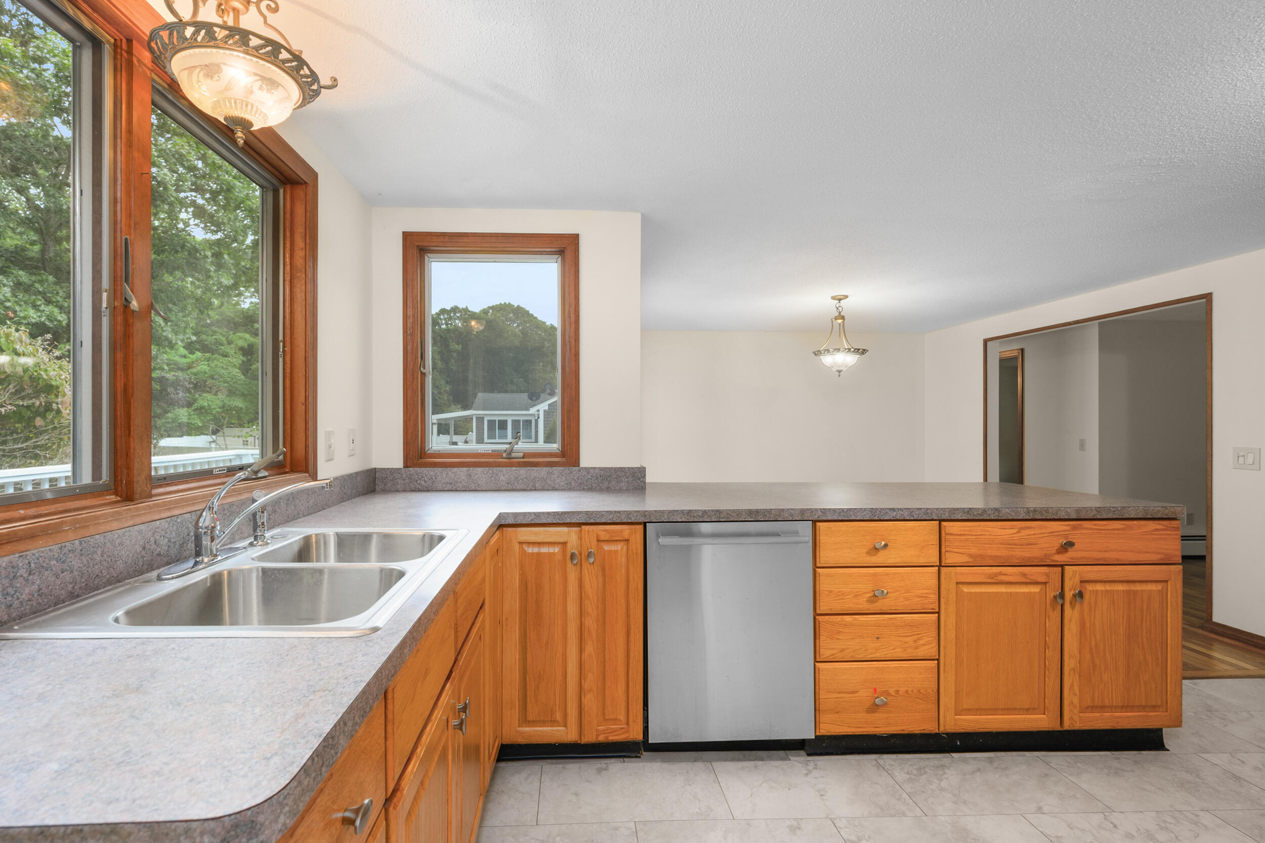 296 Buckskin Path Centerville, MA 02632 - Photo 8 of 34 a kitchen with a sink and a large window