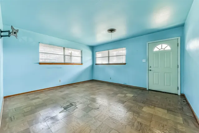 an empty room with windows