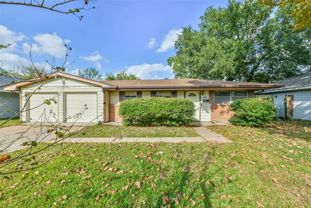 front view of a house with a big yard