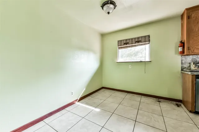 a view of a room with a projector and cabinets