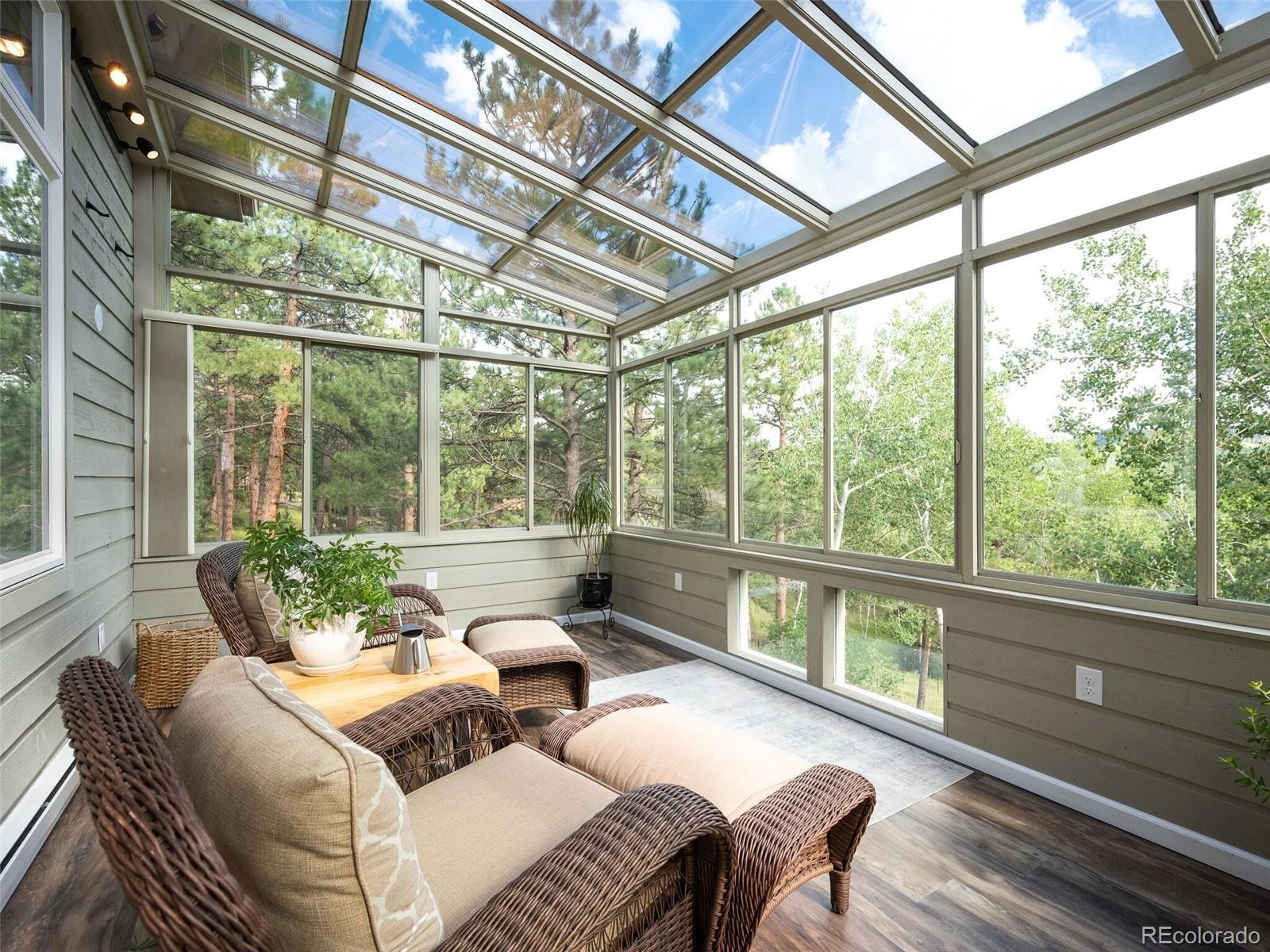 137 Nuthatch Road Evergreen, CO 80439 - Photo 18 of 50 a living room with furniture and a window