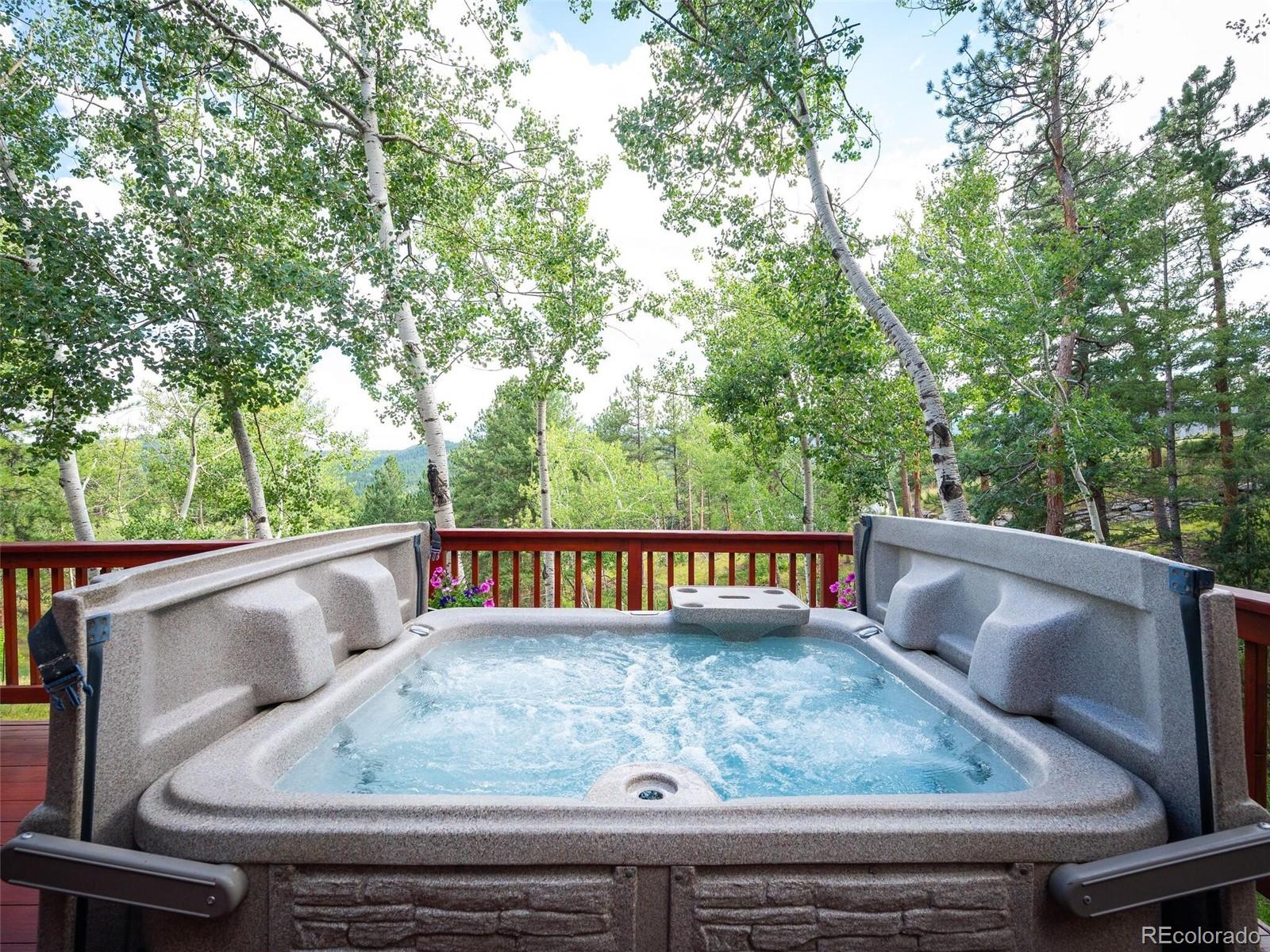 137 Nuthatch Road Evergreen, CO 80439 - Photo 19 of 50 a view of roof deck with furniture and trees