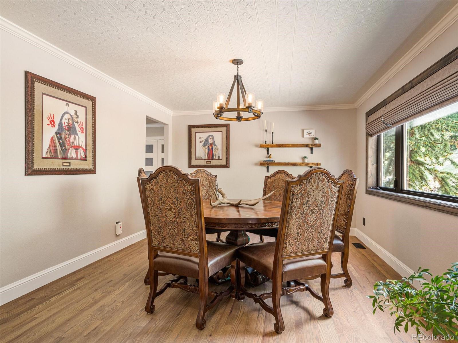 137 Nuthatch Road Evergreen, CO 80439 - Photo 24 of 50 a dining room with furniture and window