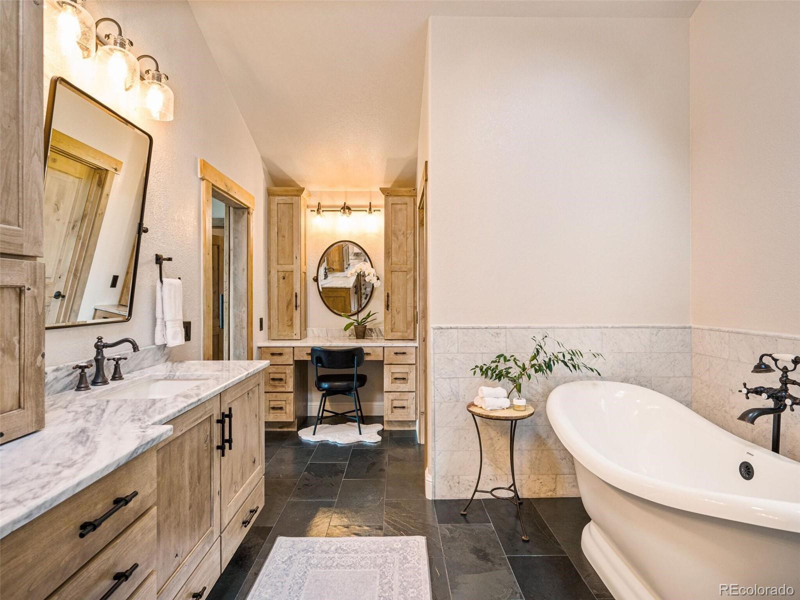 137 Nuthatch Road Evergreen, CO 80439 - Photo 30 of 50 a bathroom with a sink and a mirror