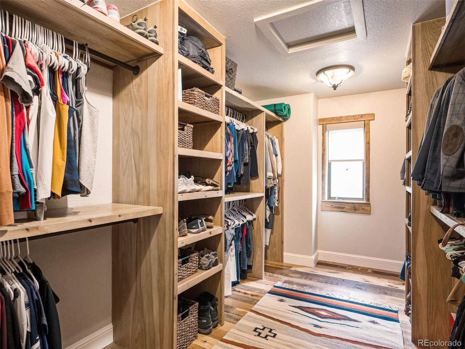 137 Nuthatch Road Evergreen, CO 80439 - Photo 32 of 50 a view of walk in closet with clothes and shoes