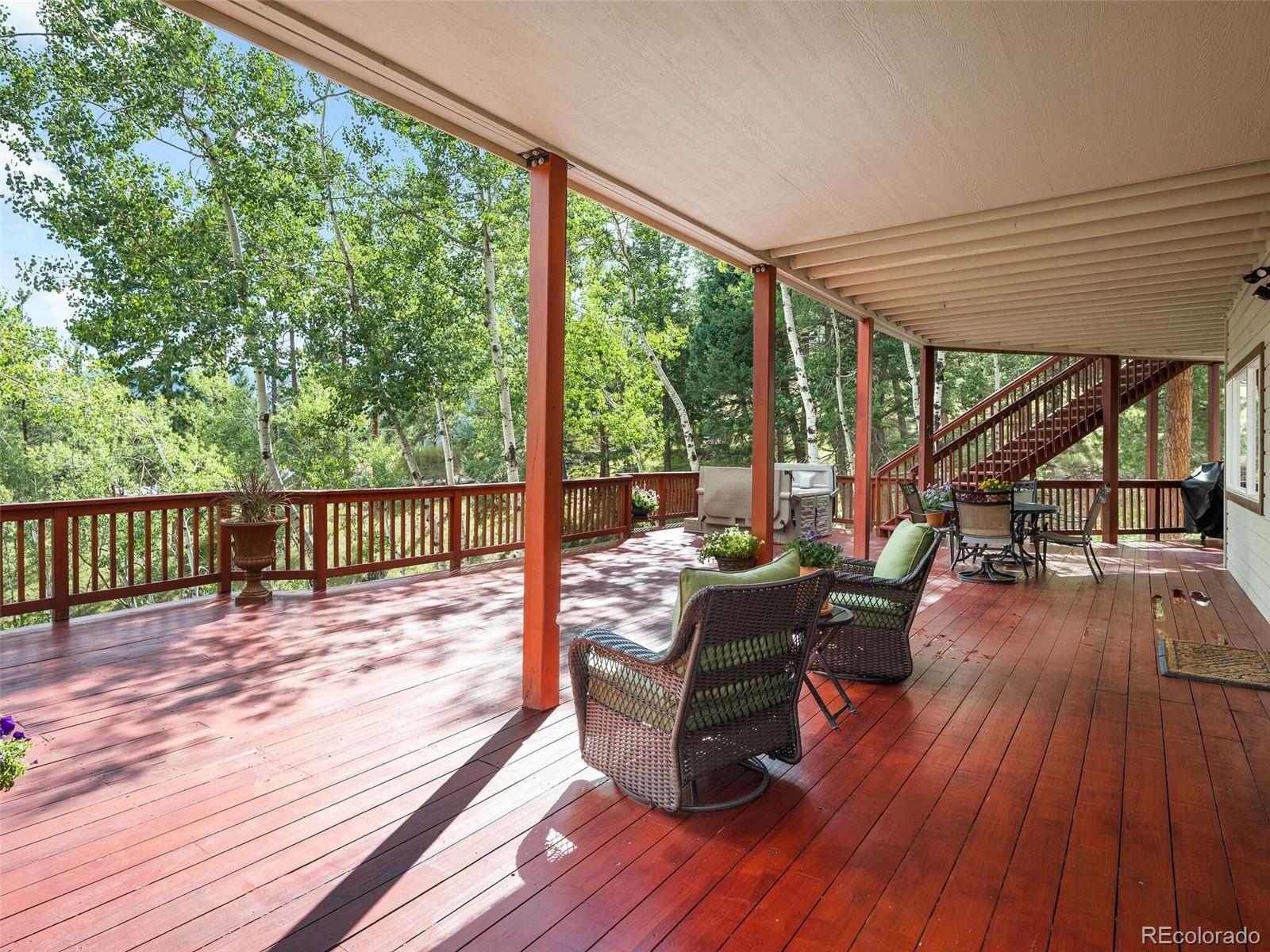 137 Nuthatch Road Evergreen, CO 80439 - Photo 44 of 50 a view of balcony with wooden floor and seating space