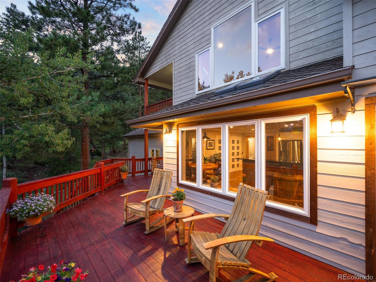 137 Nuthatch Road Evergreen, CO 80439 - Photo 48 of 50 a view of a chairs and table in the balcony