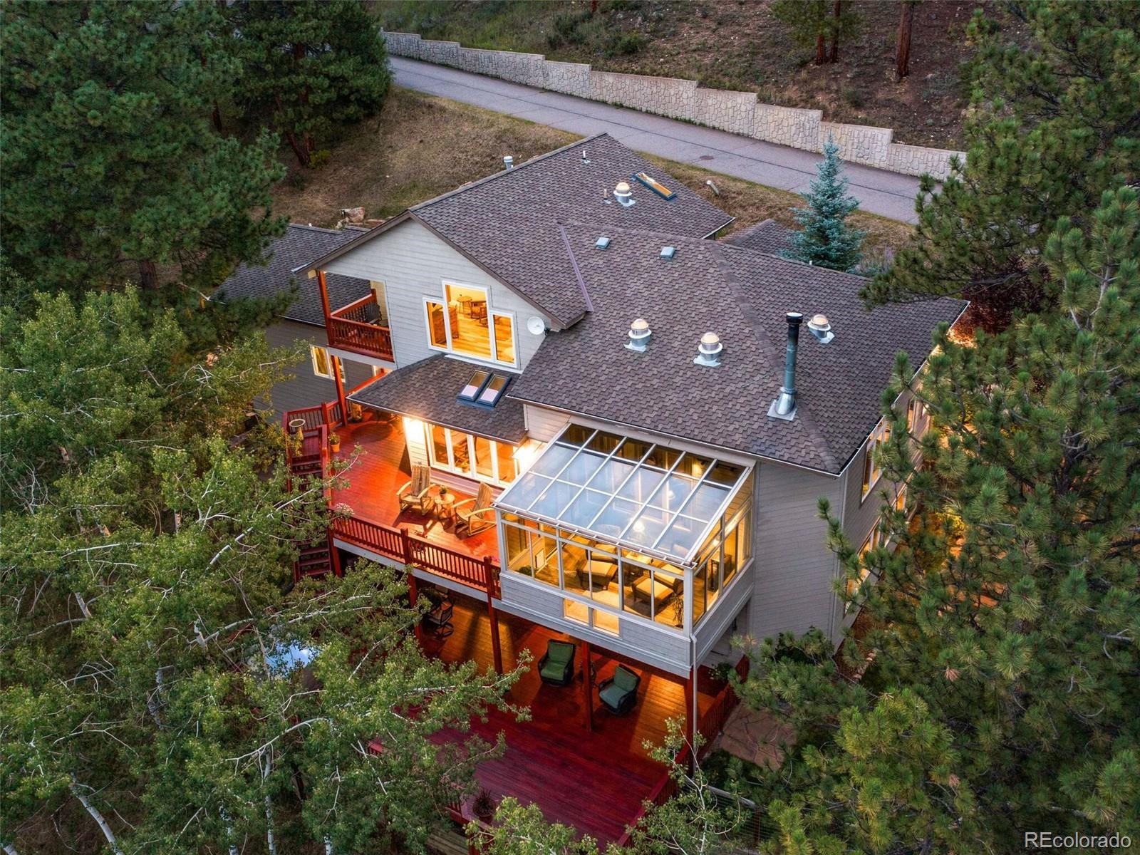 137 Nuthatch Road Evergreen, CO 80439 - Photo 50 of 50 an aerial view of a house with a yard