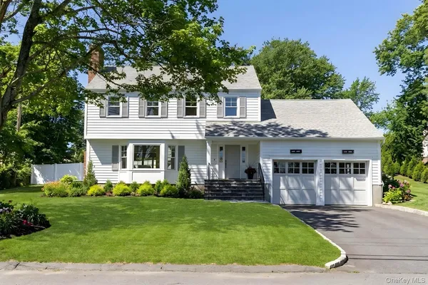 a view of a house with a yard patio and a patio