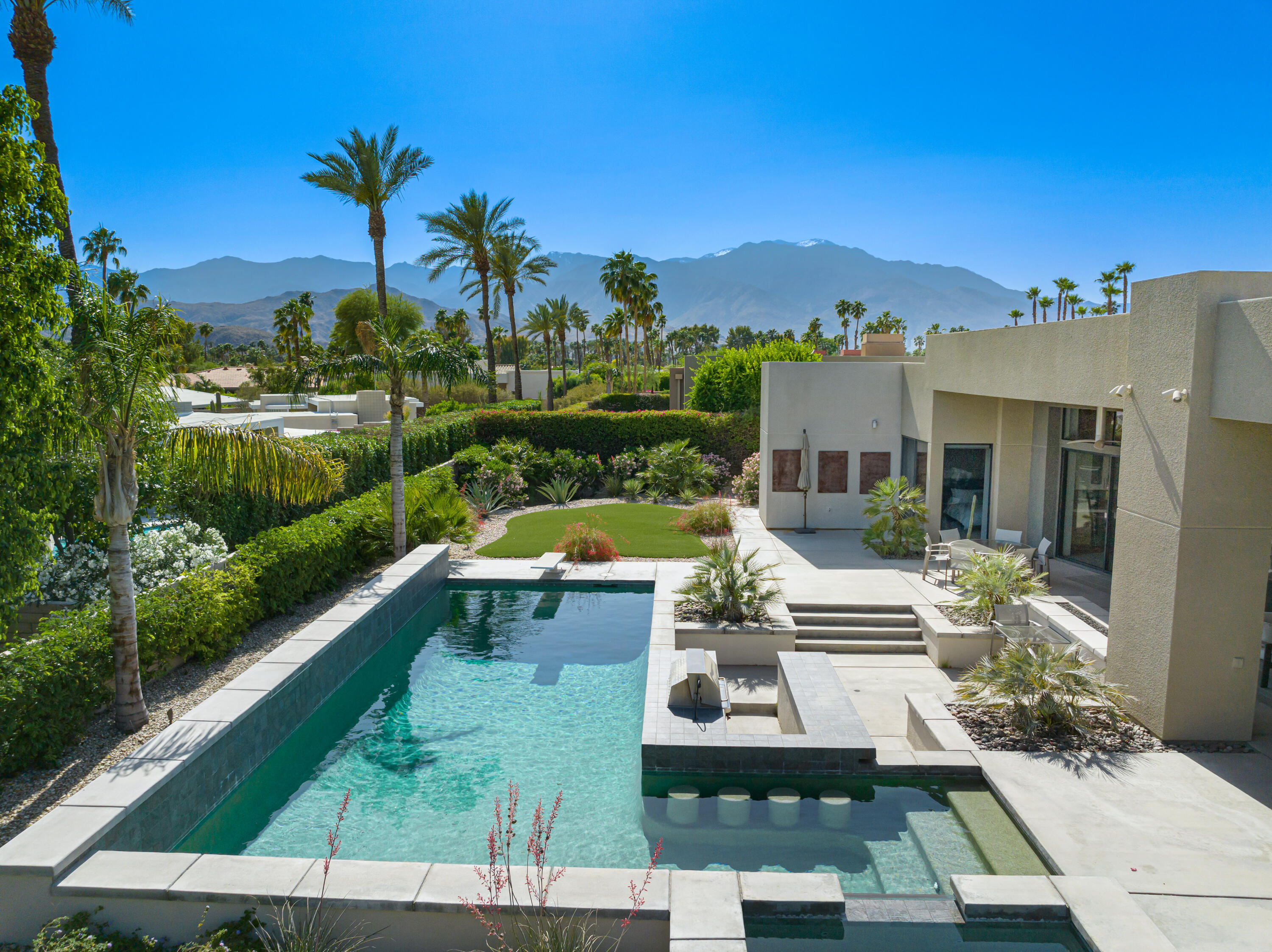 18 Boulder Lane Rancho Mirage, CA 92270 - Photo 1 of 41 a view of house with swimming pool outdoor seating