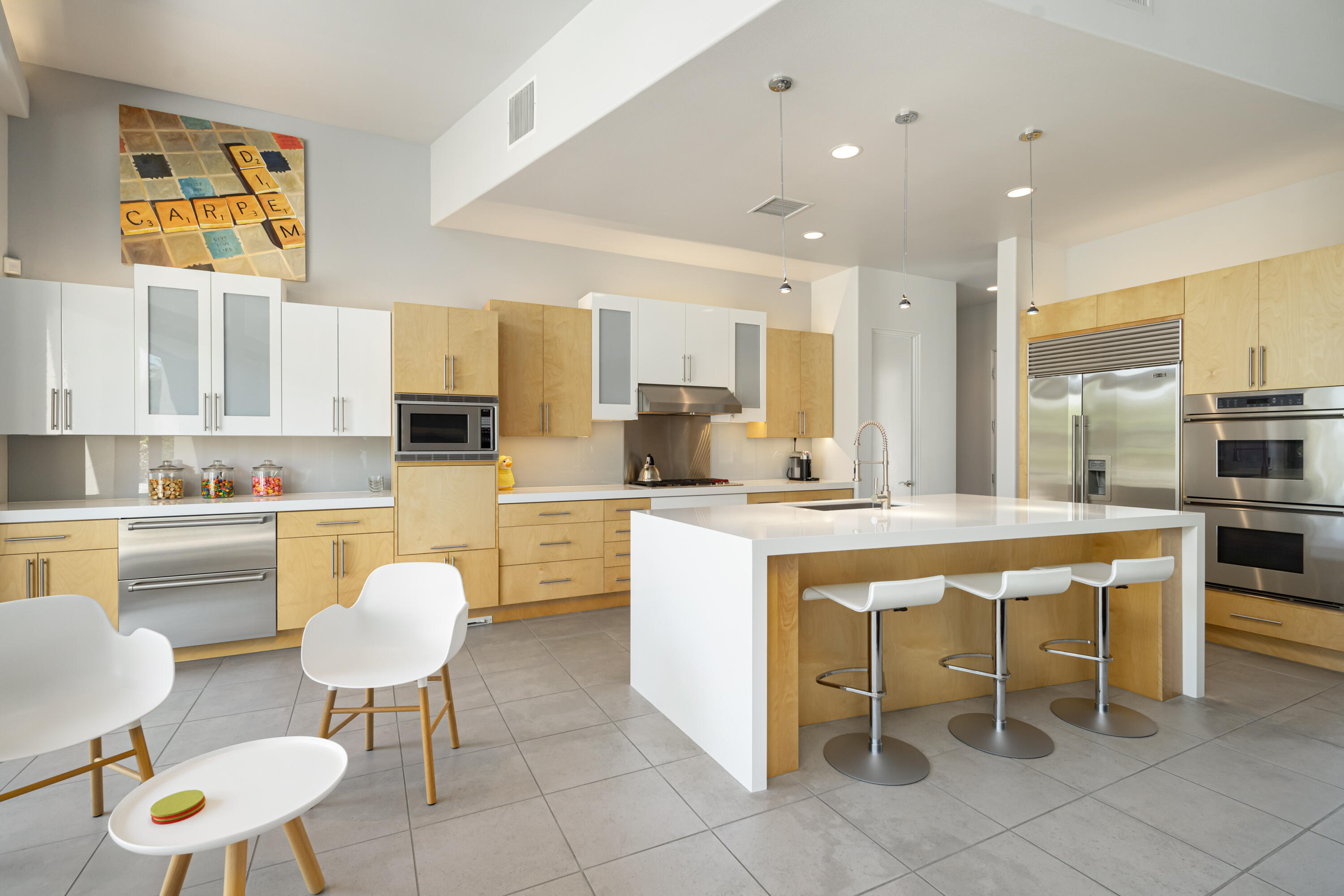 18 Boulder Lane Rancho Mirage, CA 92270 - Photo 13 of 41 a kitchen with a sink and chairs
