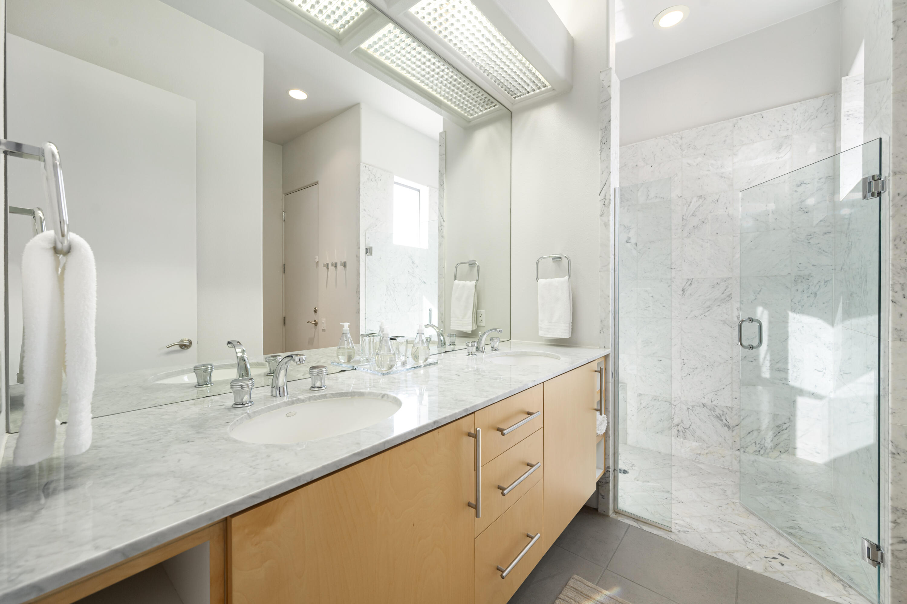 18 Boulder Lane Rancho Mirage, CA 92270 - Photo 23 of 41 a bathroom with a double vanity sink mirror and shower