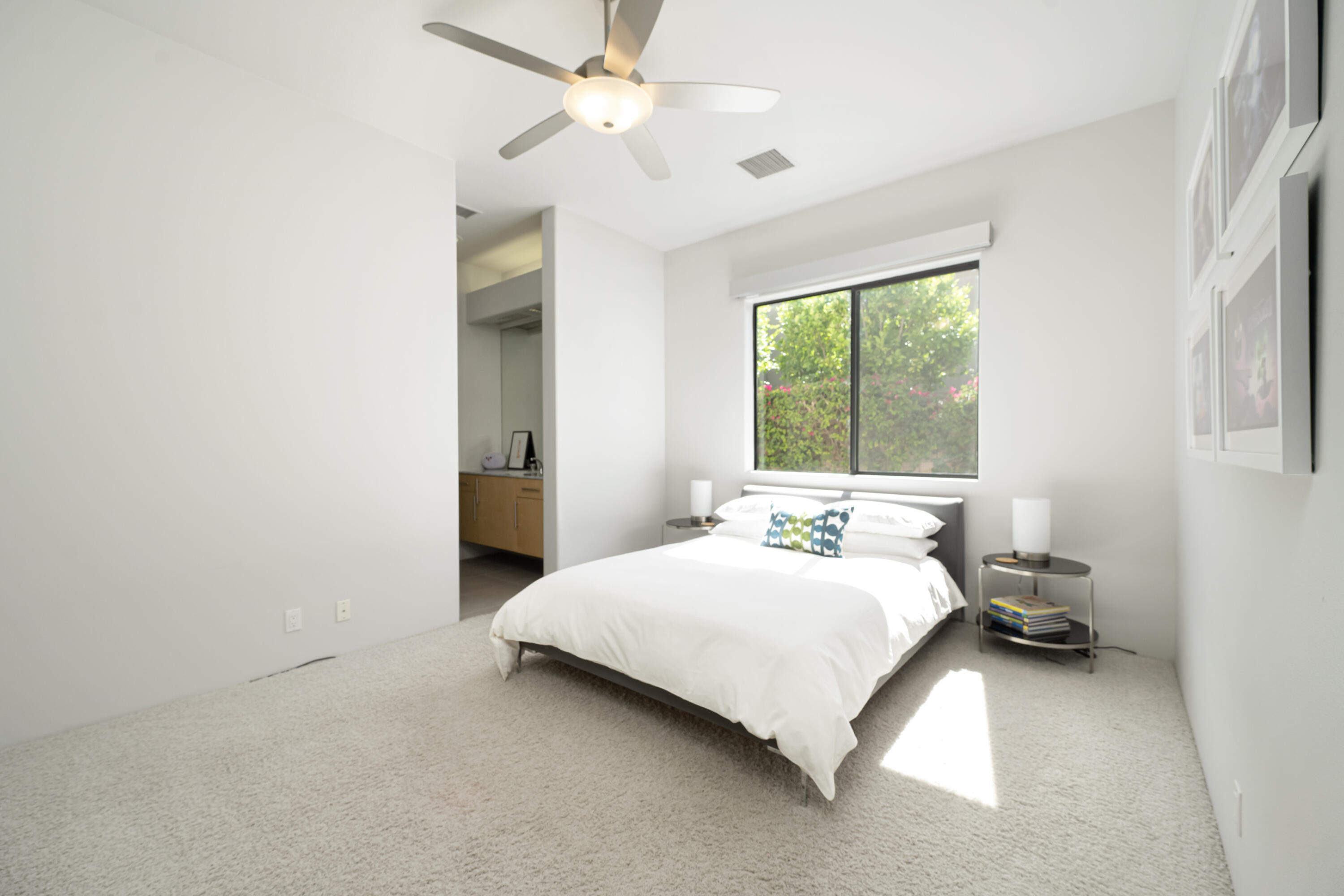 18 Boulder Lane Rancho Mirage, CA 92270 - Photo 24 of 41 a bedroom with a bed and a window