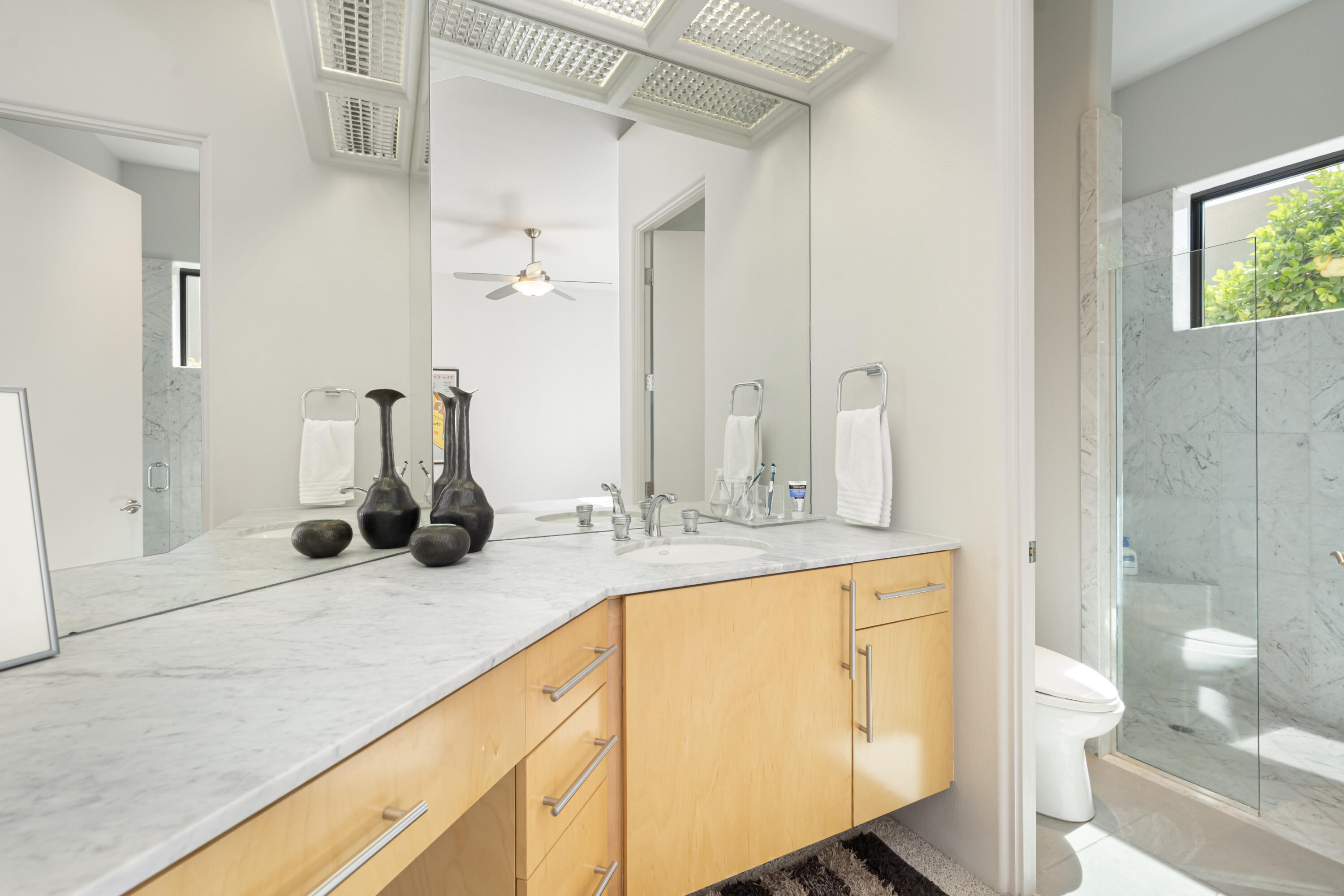 18 Boulder Lane Rancho Mirage, CA 92270 - Photo 27 of 41 a bathroom with a sink and a mirror