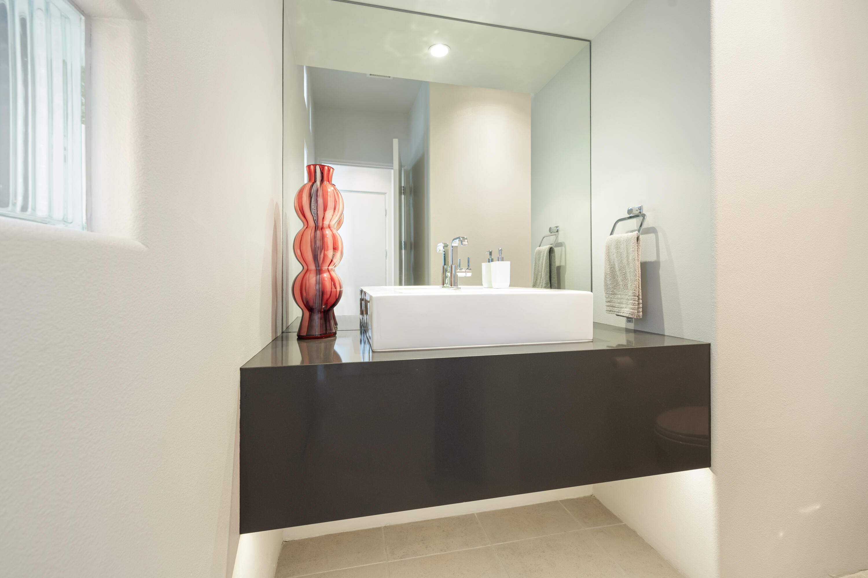18 Boulder Lane Rancho Mirage, CA 92270 - Photo 28 of 41 a bathroom with a sink and a mirror