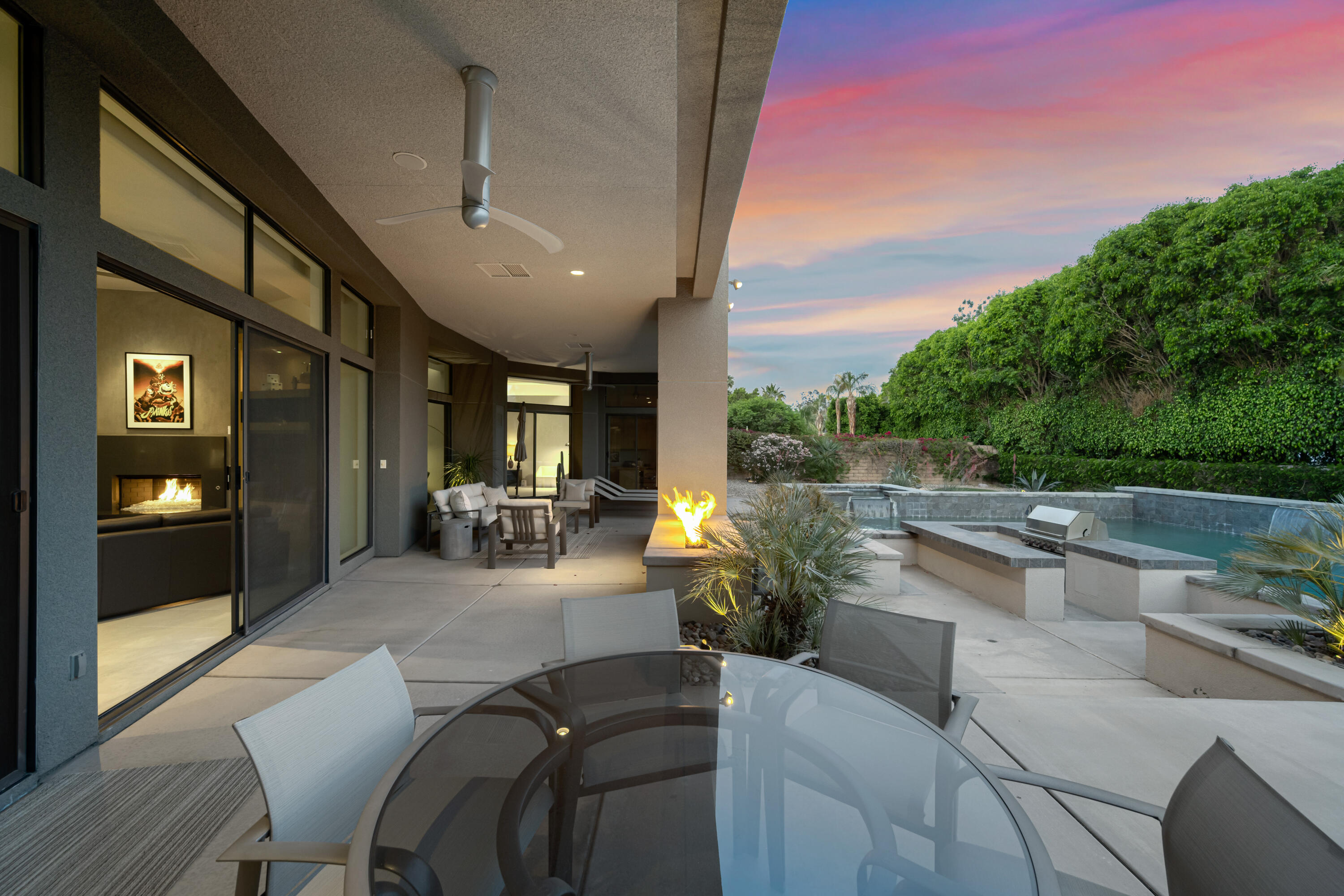 18 Boulder Lane Rancho Mirage, CA 92270 - Photo 31 of 41 a view of a patio with couches table and chairs and potted plants