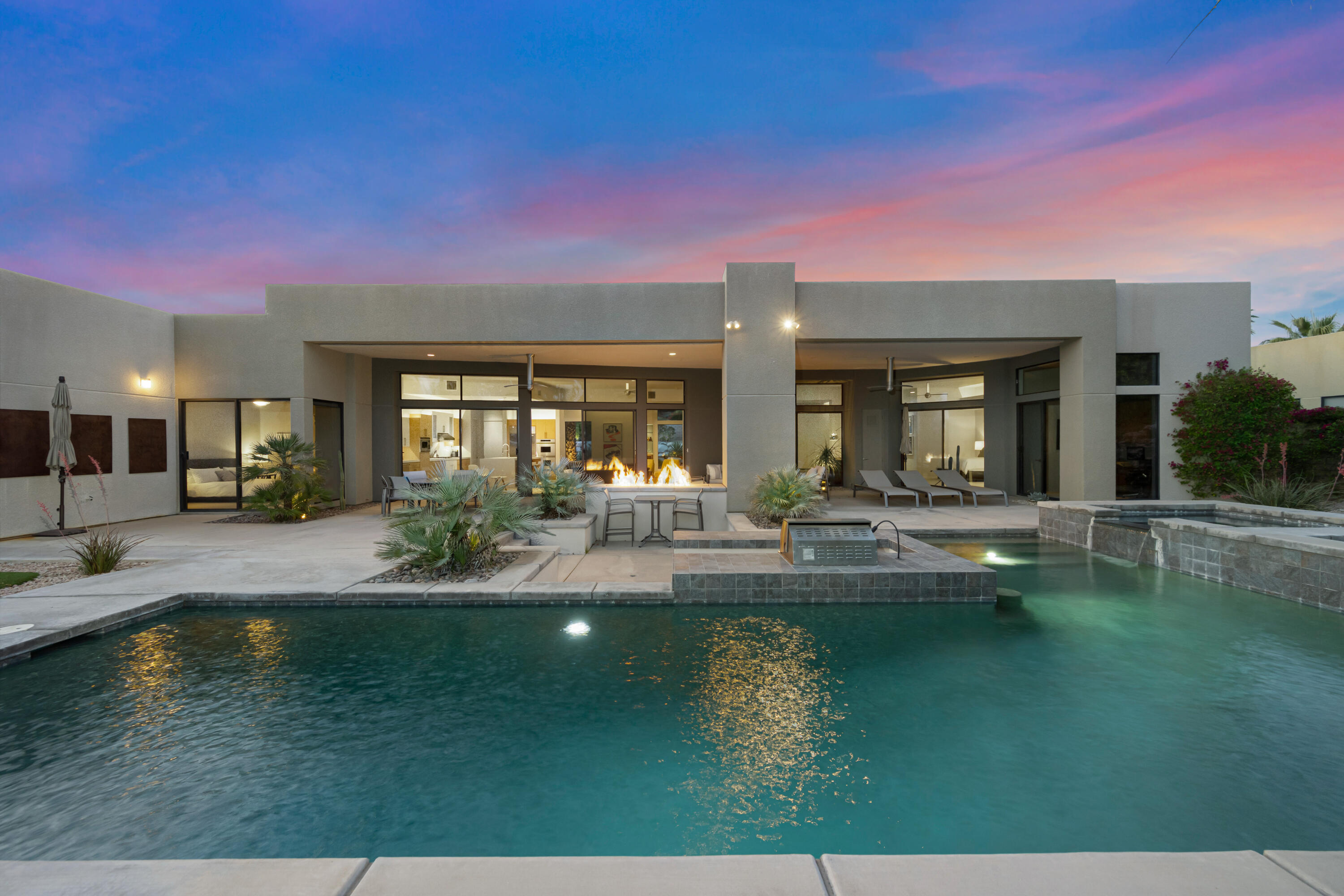 18 Boulder Lane Rancho Mirage, CA 92270 - Photo 36 of 41 a view of an house with swimming pool and porch