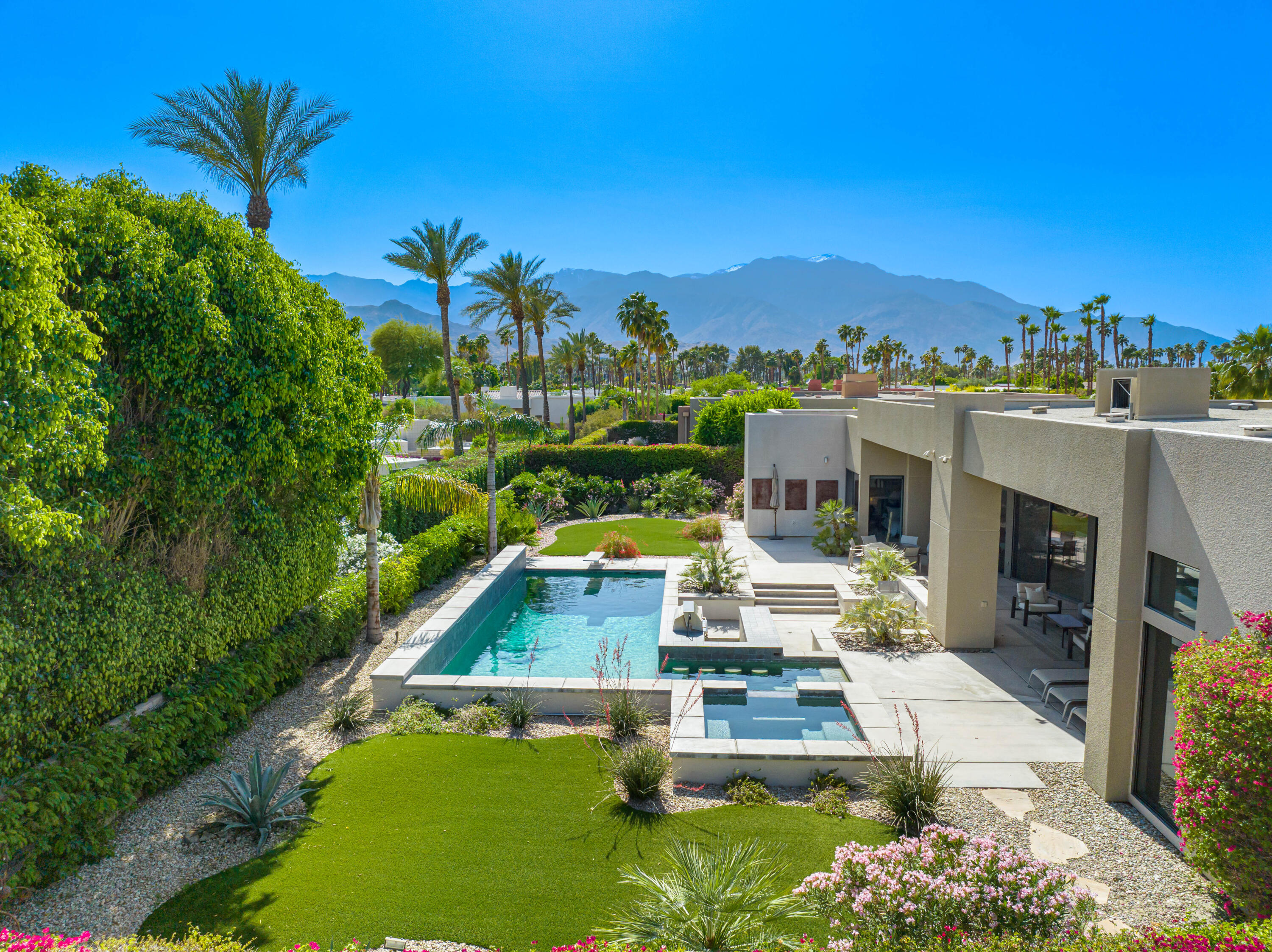 18 Boulder Lane Rancho Mirage, CA 92270 - Photo 38 of 41 a view of a swimming pool with a patio and a yard