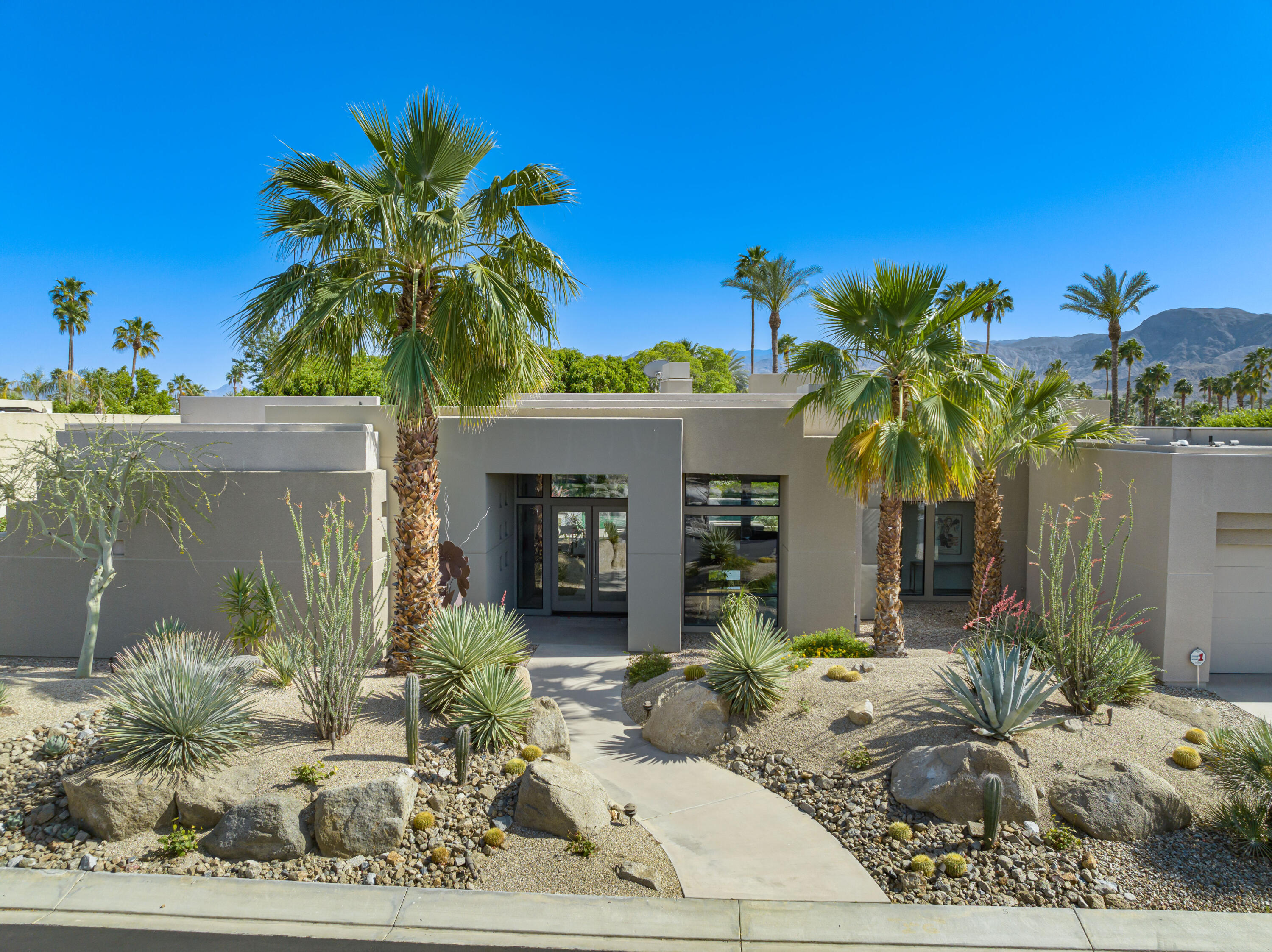 18 Boulder Lane Rancho Mirage, CA 92270 - Photo 40 of 41 a front view of a house with garden