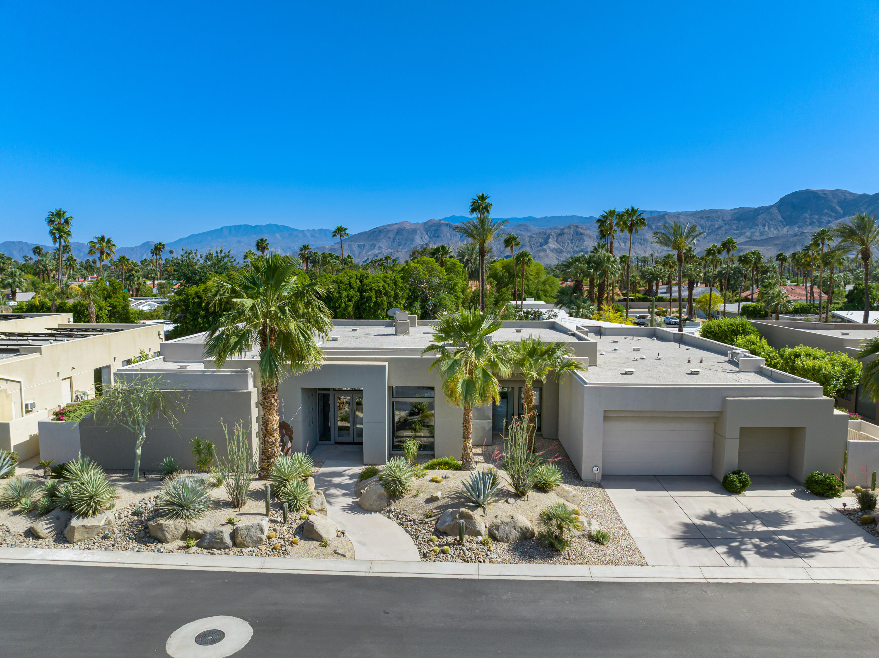 18 Boulder Lane Rancho Mirage, CA 92270 - Photo 41 of 41 a front view of a house with a yard and garage