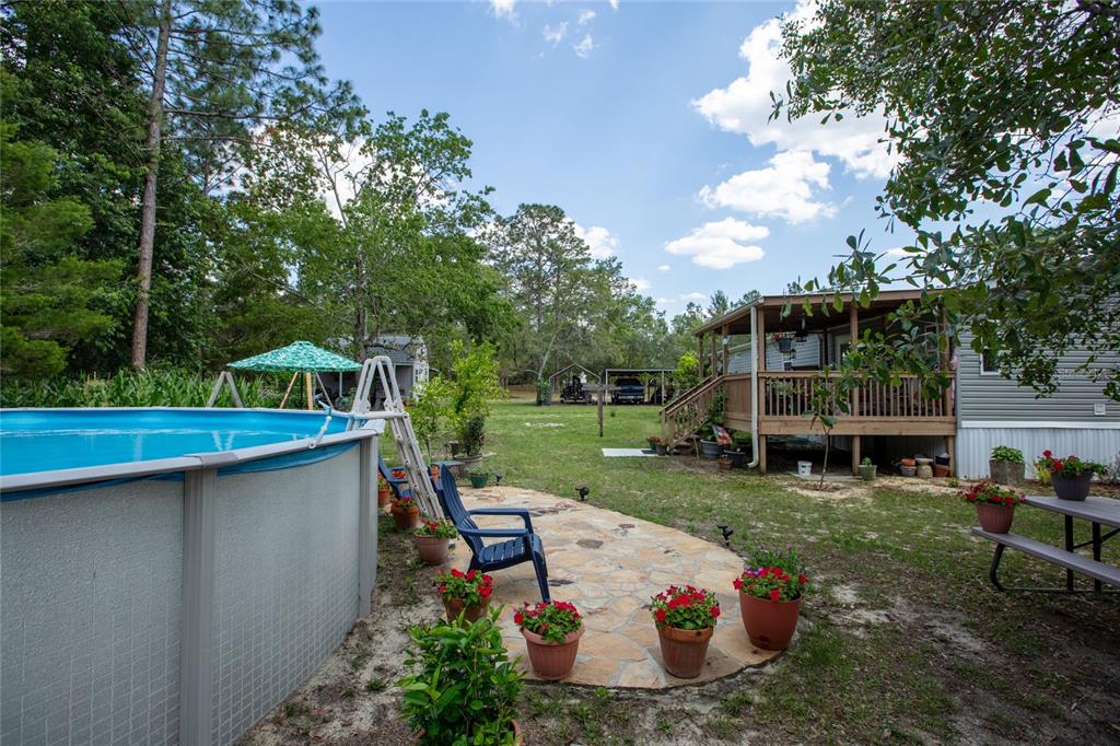 5670 Acadia Street Keystone Heights, FL 32656 - Photo 19 of 65 a view of a table and chairs in roof deck