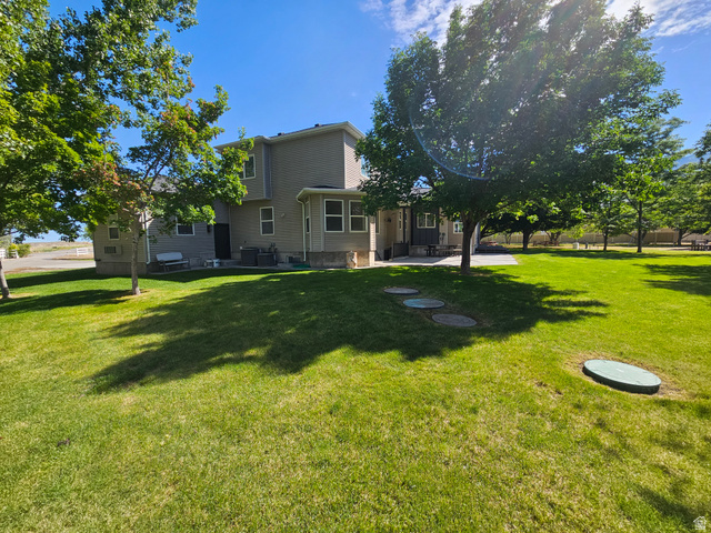 812 East Bates Cyn Road Tooele, UT 84074 - Photo 140 of 144 Expansive green lawn with mature trees providing natural shading