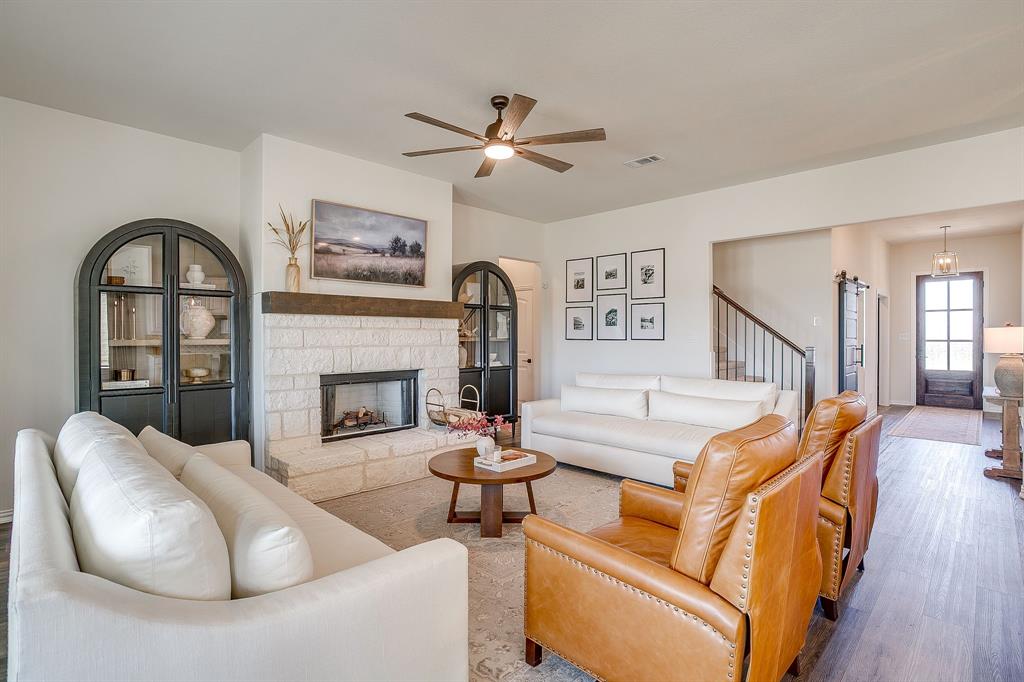 445 Guadalupe Lane Springtown, TX 76082 - Photo 11 of 40 Living room with stone wood burning fireplace
