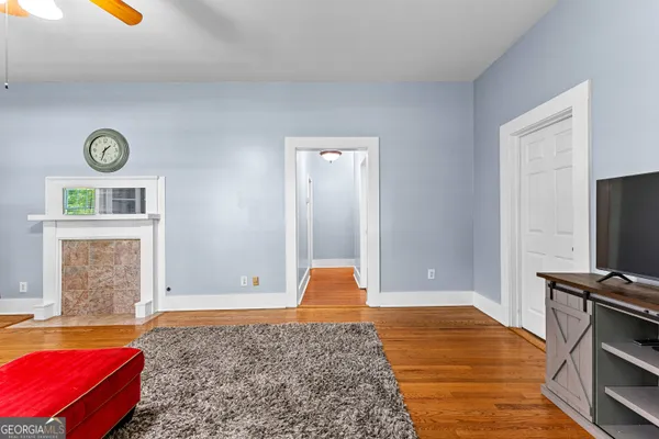 a bedroom with a bed and a lamp