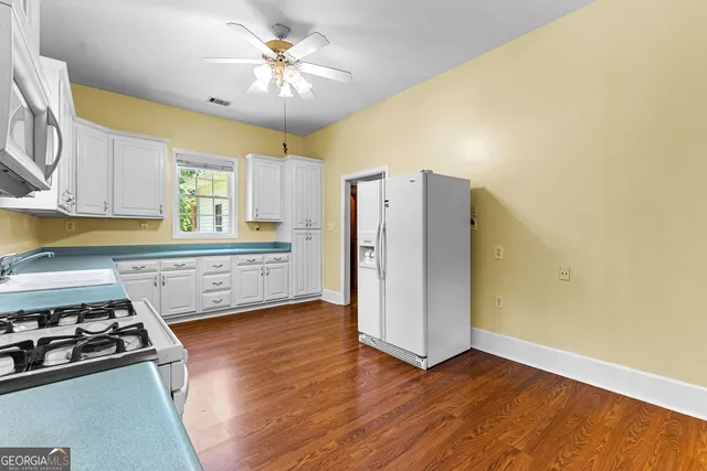 a kitchen with a stove and a refrigerator