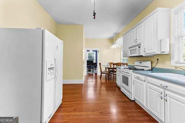 a hallway with two air conditioner and a window