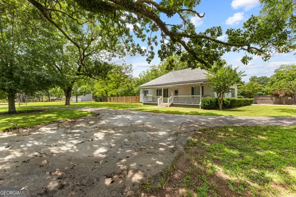a front view of a house with a yard