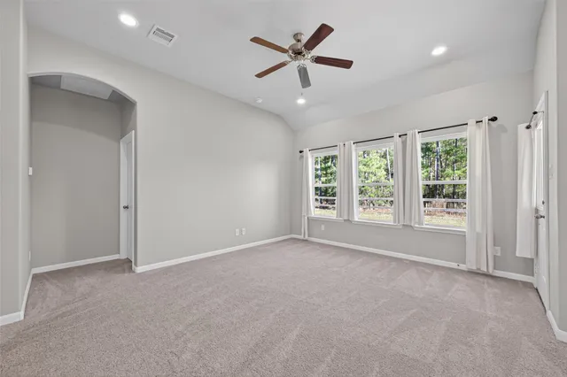 a large kitchen with kitchen island granite countertop a stove a sink a refrigerator and a granite counter top