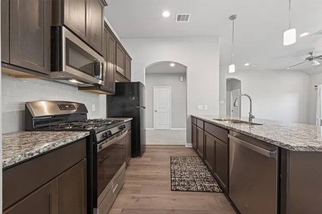 a spacious bedroom with a bed and window