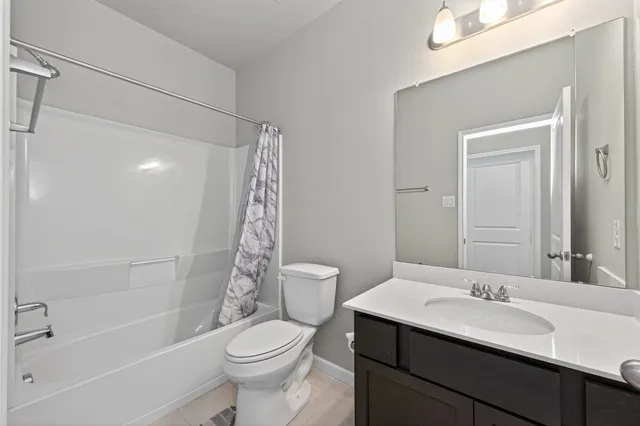 a bedroom with a bed and a ceiling fan