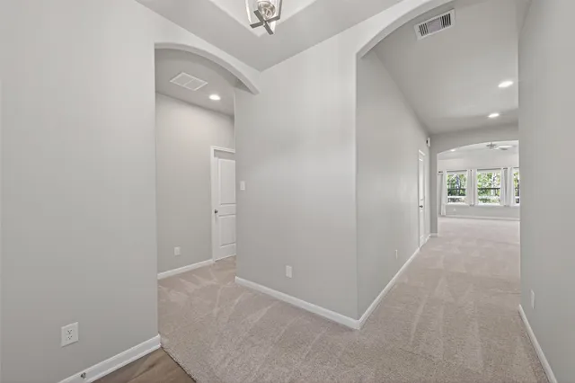 a view of a kitchen with a sink and a window