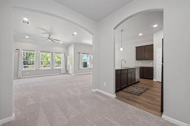 a view of a livingroom with a kitchen