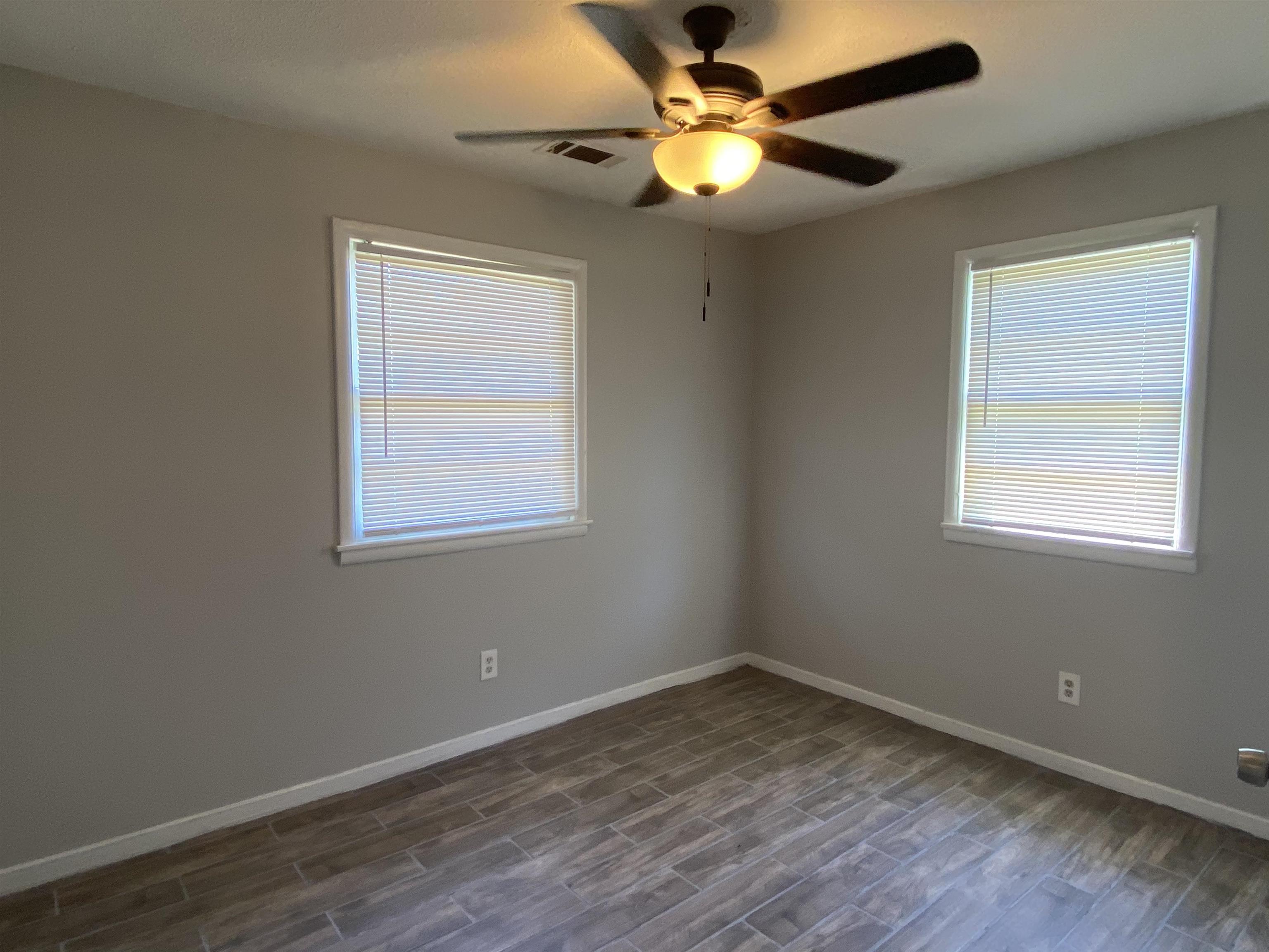 3513 Ashford Road Memphis, TN 38109 - Photo 8 of 21 a view of empty room with wooden floor