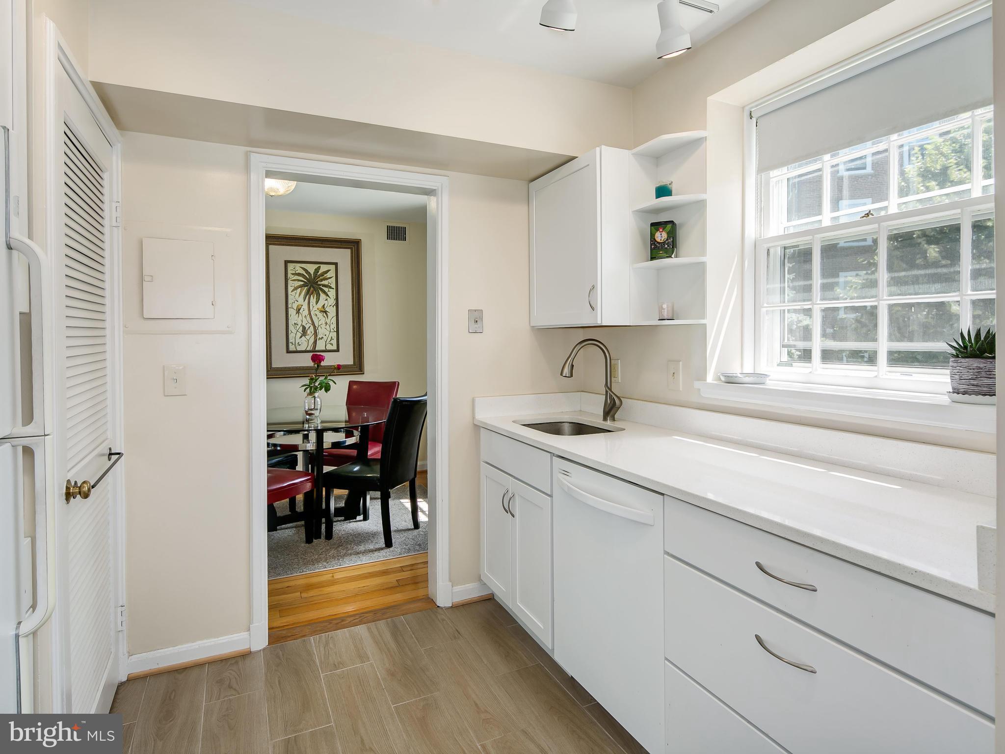 3851 Porter Street Northwest, Unit D280 Washington, DC 20016 - Photo 2 of 22 a kitchen with sink and cabinets
