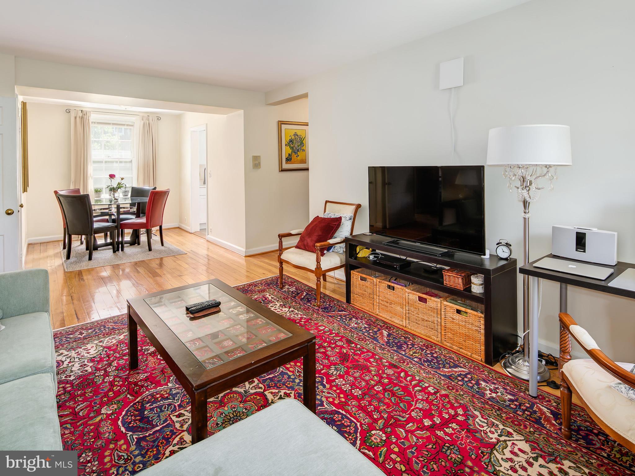 3851 Porter Street Northwest, Unit D280 Washington, DC 20016 - Photo 11 of 22 a living room with furniture and a flat screen tv