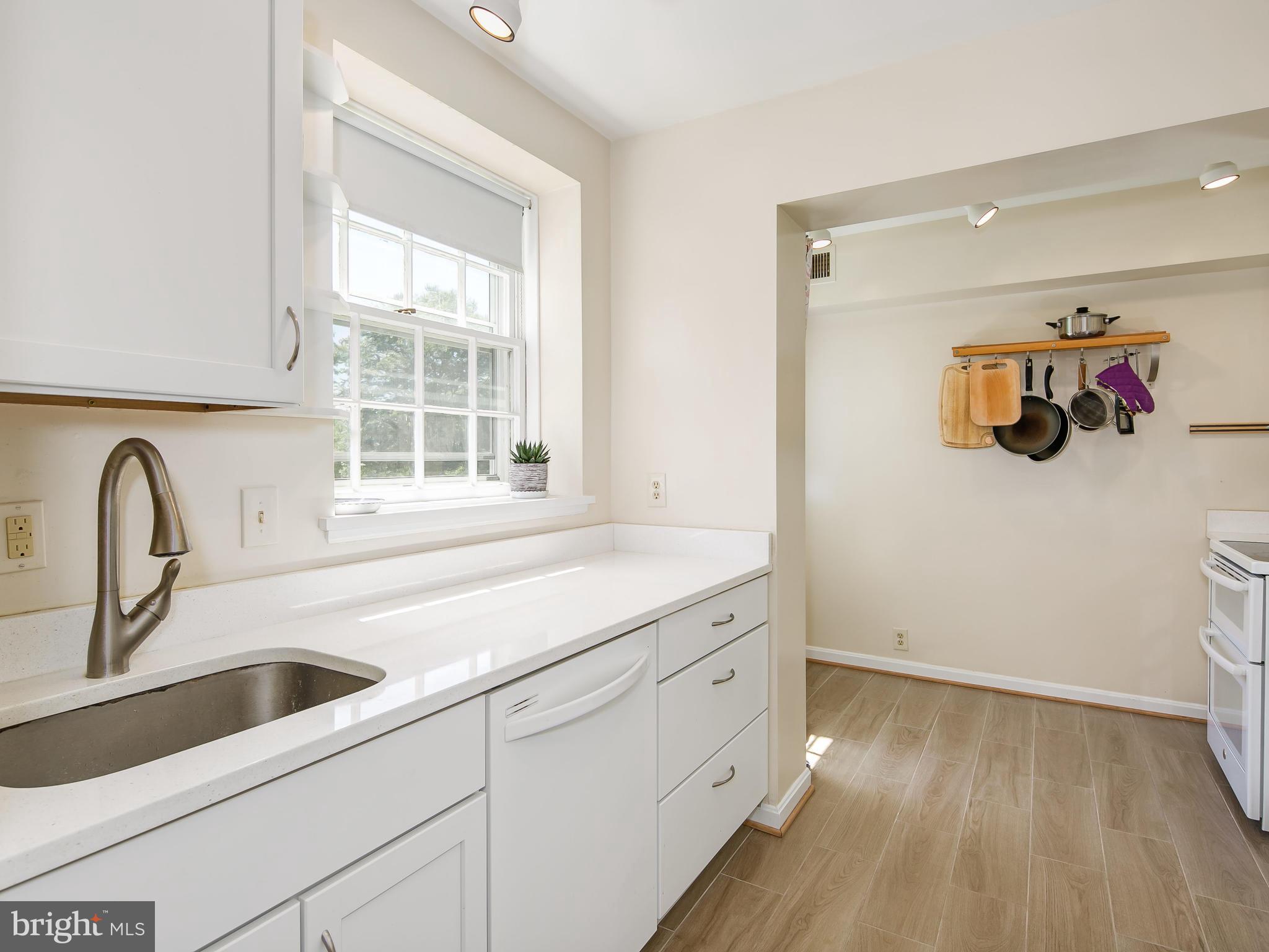 3851 Porter Street Northwest, Unit D280 Washington, DC 20016 - Photo 15 of 22 a utility room with sink dryer and washer