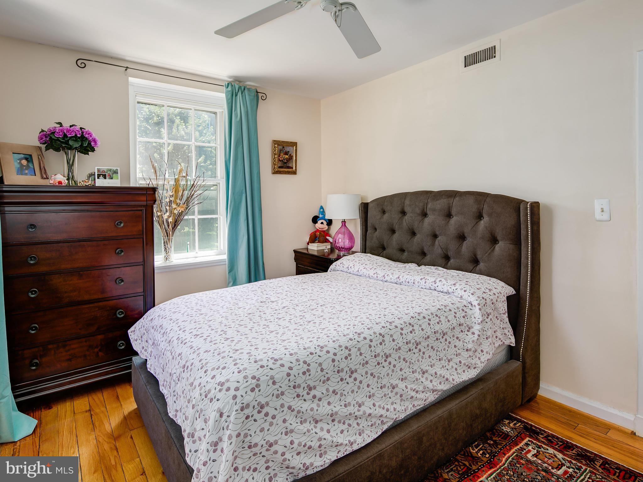 3851 Porter Street Northwest, Unit D280 Washington, DC 20016 - Photo 19 of 22 a bedroom with a bed and a dresser