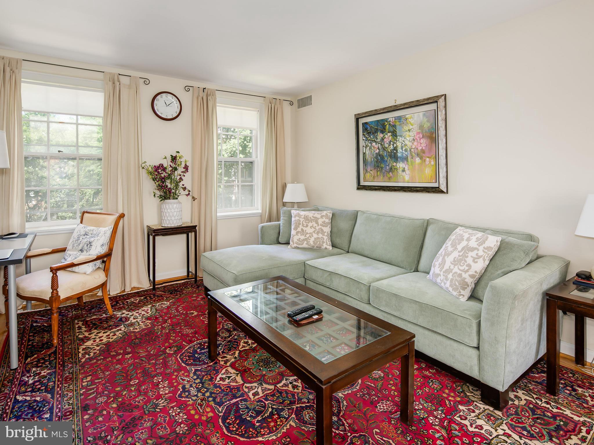 3851 Porter Street Northwest, Unit D280 Washington, DC 20016 - Photo 6 of 22 a living room with furniture and a window