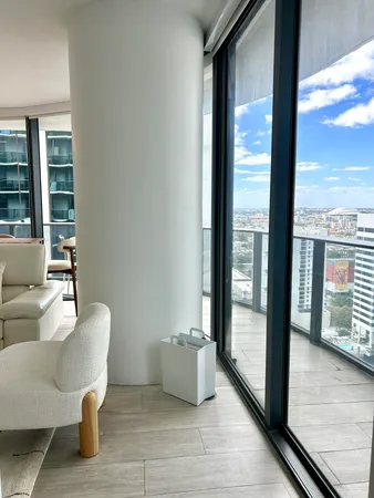 a view of a livingroom with furniture window and wooden floor