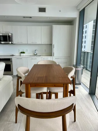 a view of living room with furniture and flat screen tv