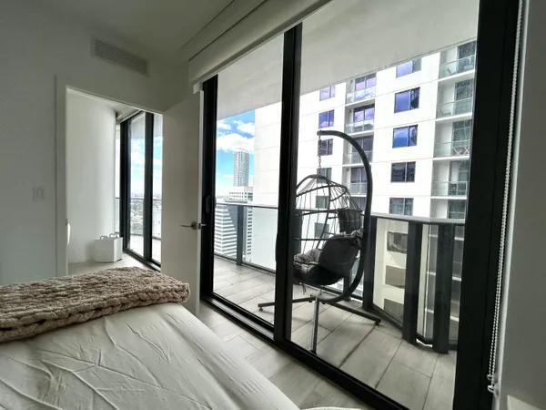 a view of walk in closet and bedroom