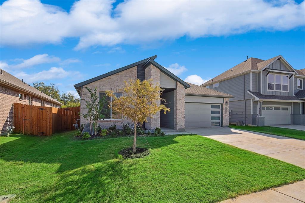 2217 Yellowhammer Road Denton, TX 76205 - Photo 2 of 30 a front view of house with yard and green space